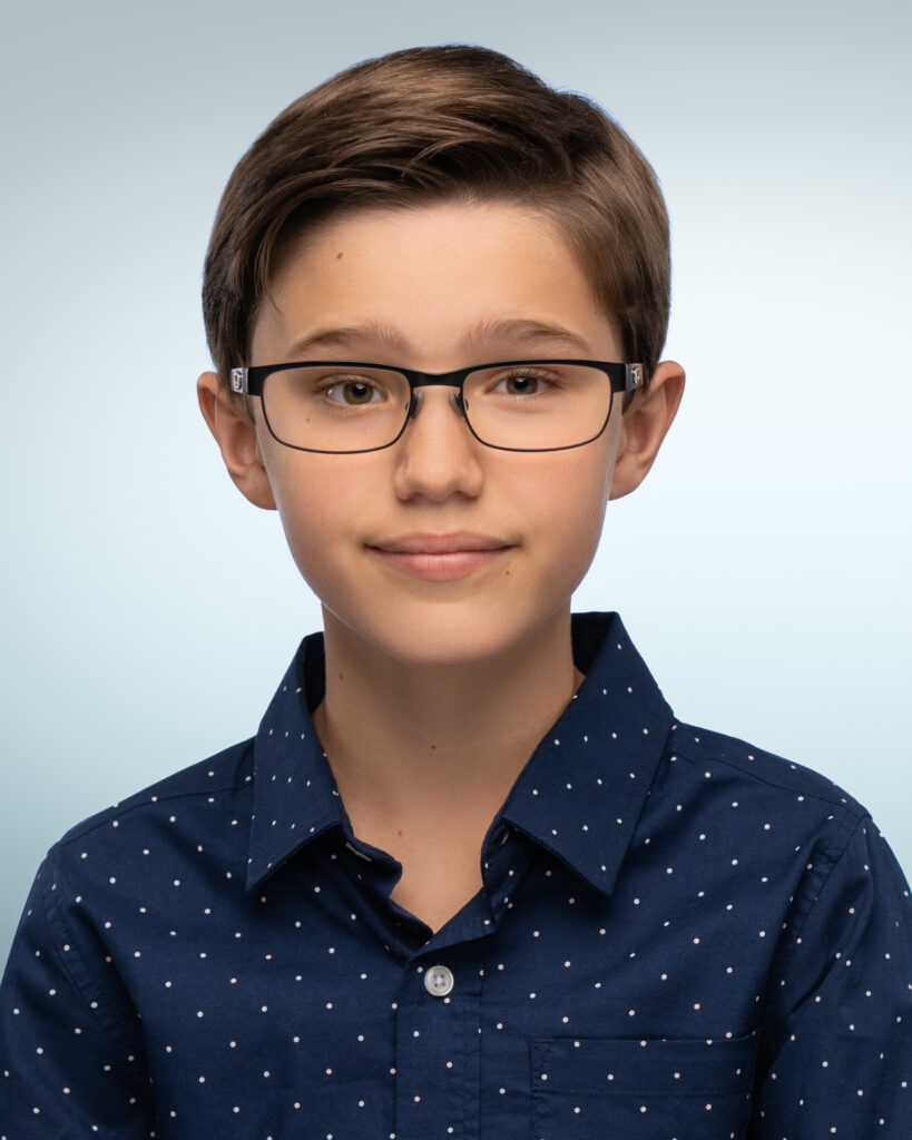 Professional headshot of Dylan Emery, showcasing his dynamic presence and versatility as an actor, known for his performances in improvised theatre and comedy.