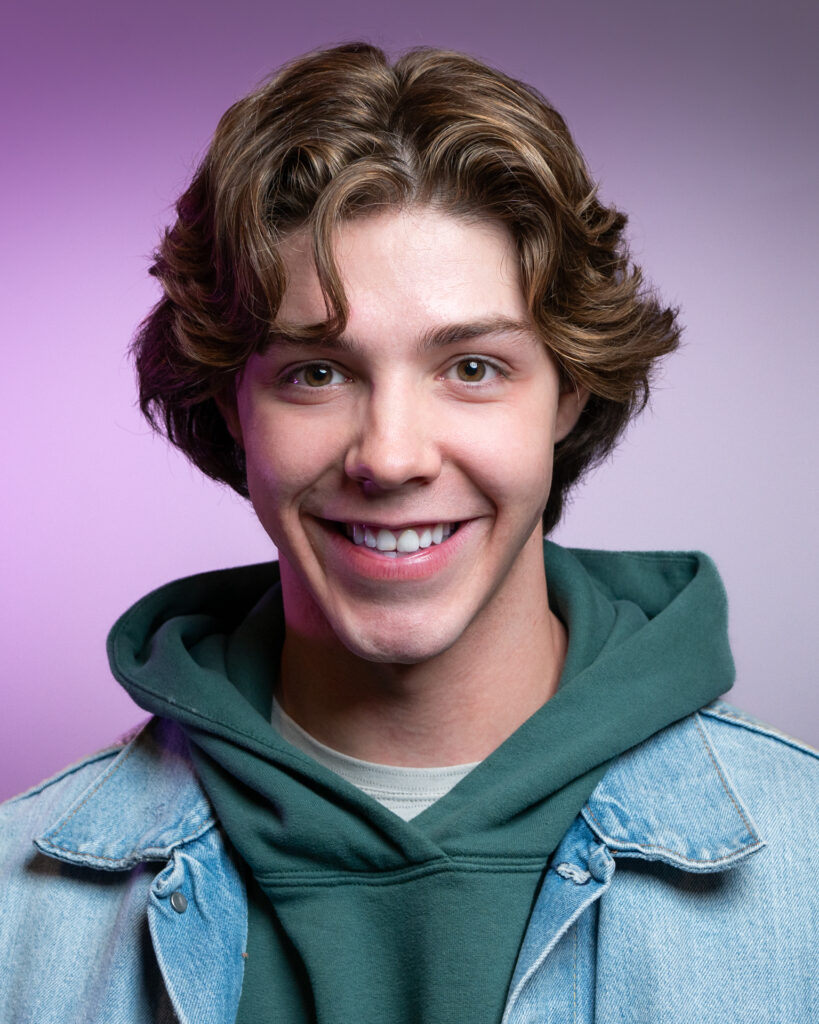 Happy teen actor posing for professional headshot