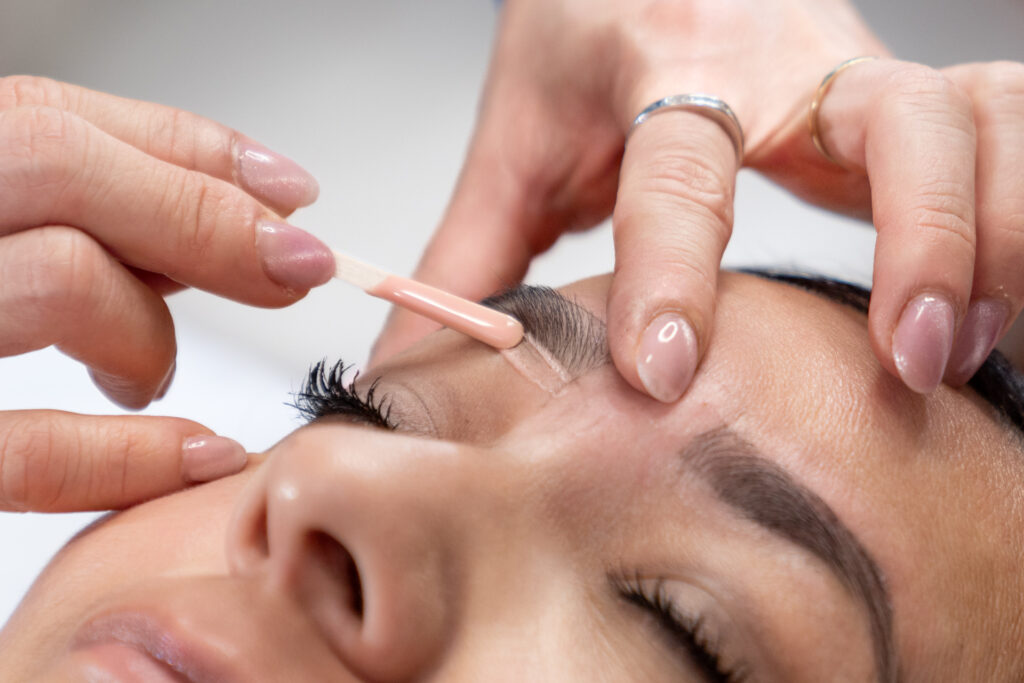 Branding environment business photo session, eyebrow wasing for AVA Permanent Makeup & Spa, captured by Art of Portraits, showcasing professional beauty services in a modern spa setting