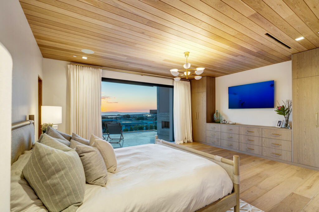 Elegant bedroom with sunset view in Orange County, CA—captured by Art of Portraits® for luxury real estate photography and upscale property listings.
