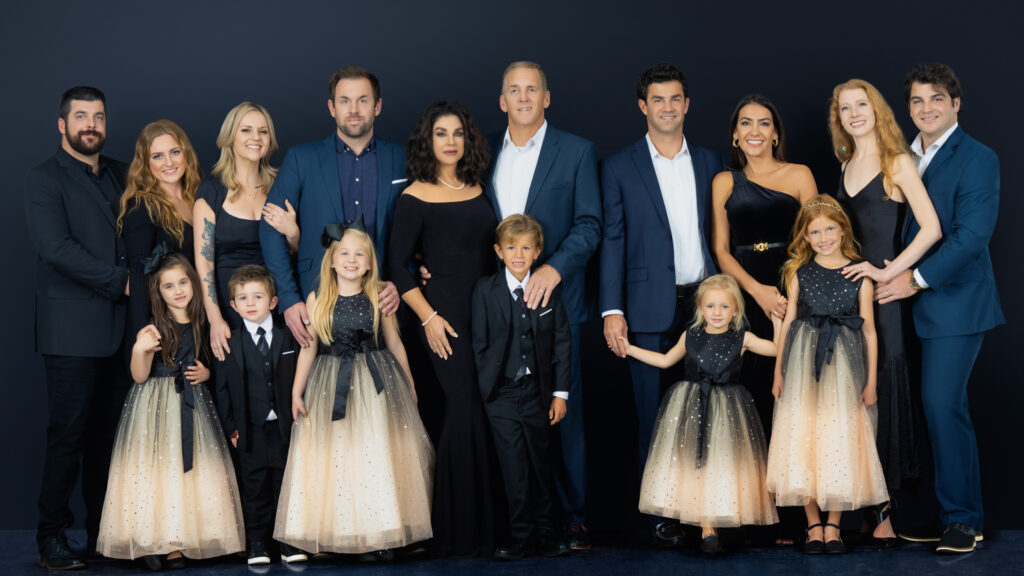 family group photo captured in Newport Beach by Art of Portraits, featuring natural light and candid expressions