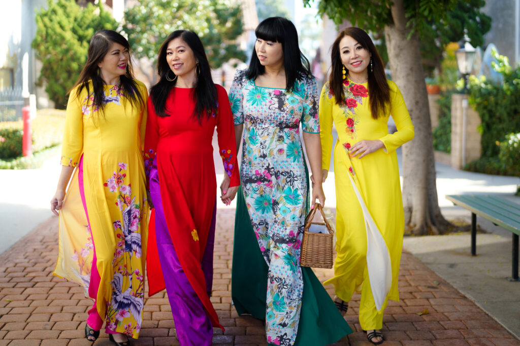 Woman in Lunar New Year traditional dress posing in outdoor lifestyle portrait