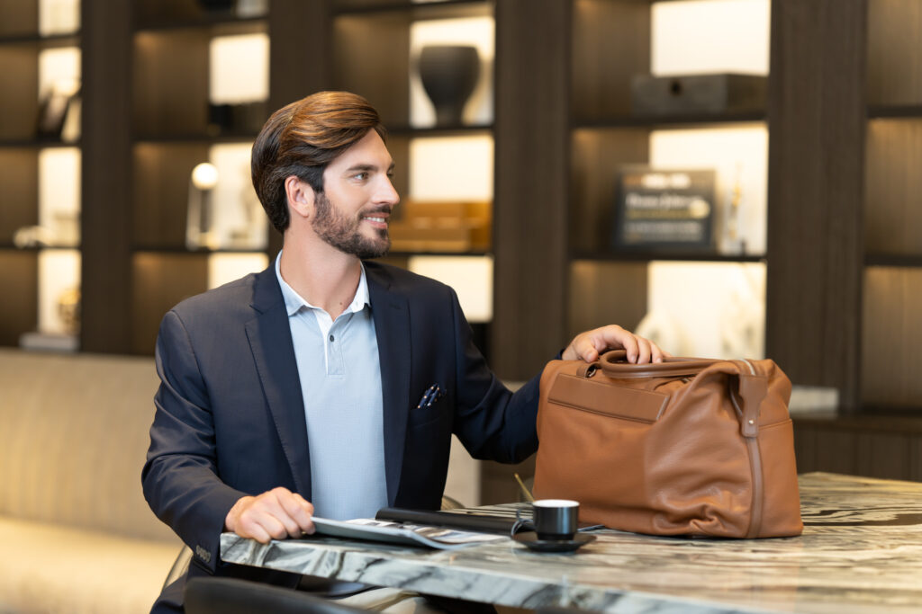 Branding lifestyle portrait of Tien Vo for J. Hilburn, captured outdoors in Newport Beach by Art of Portraits, showcasing modern menswear and personal style