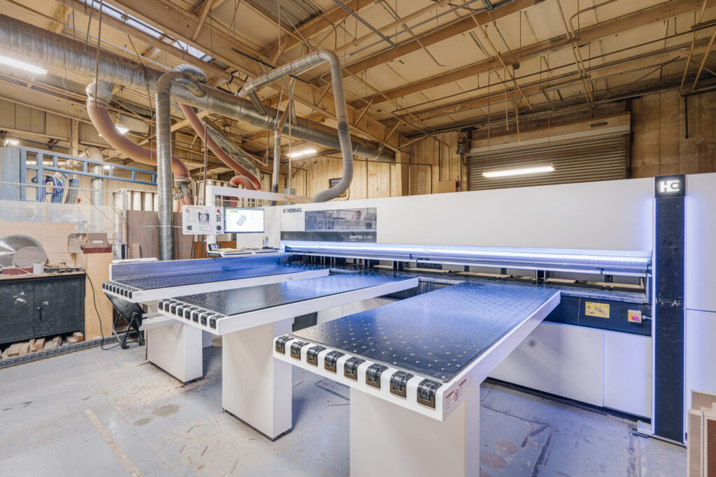 Automated commercial manufacturing machinery in high-volume production facility