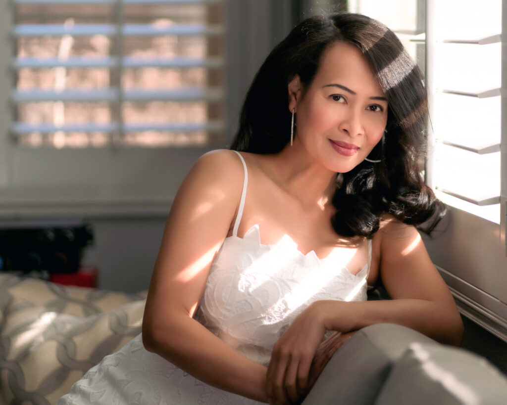 Intimate at-home wedding moment captured in soft natural window light — a timeless lifestyle portrait showcasing elegance and emotion, perfect for a refined photography portfolio.