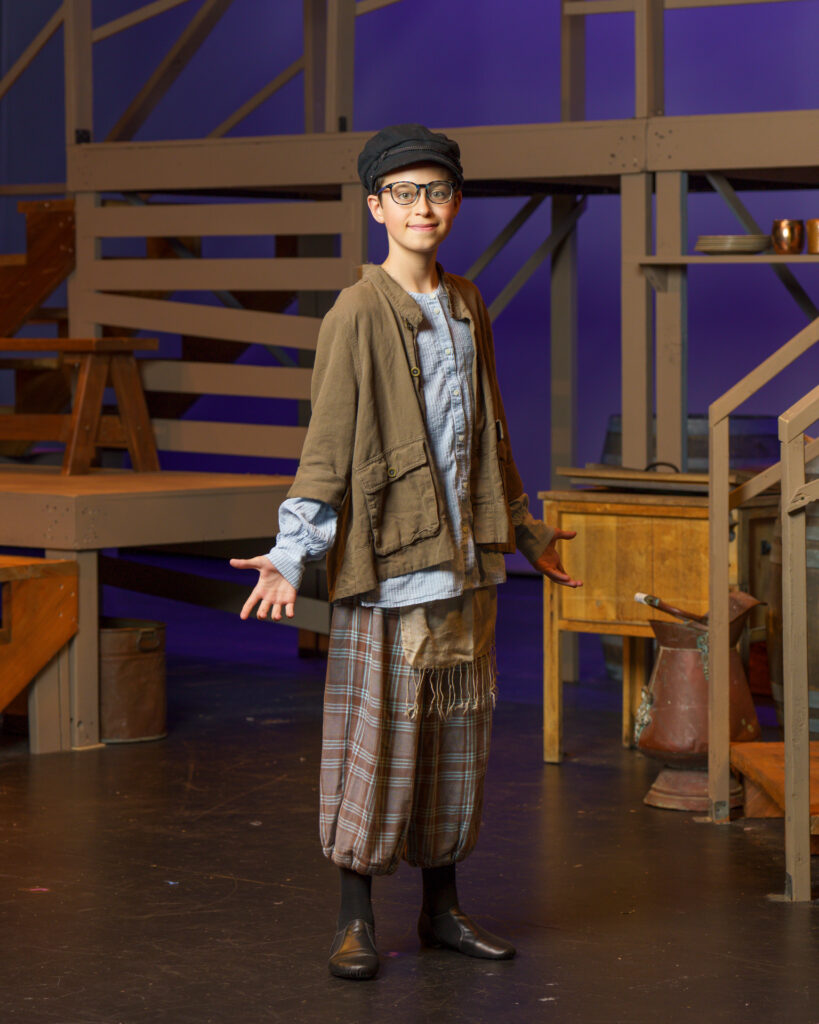 An Actor on stage with costume for Fiddler on the Roof musical