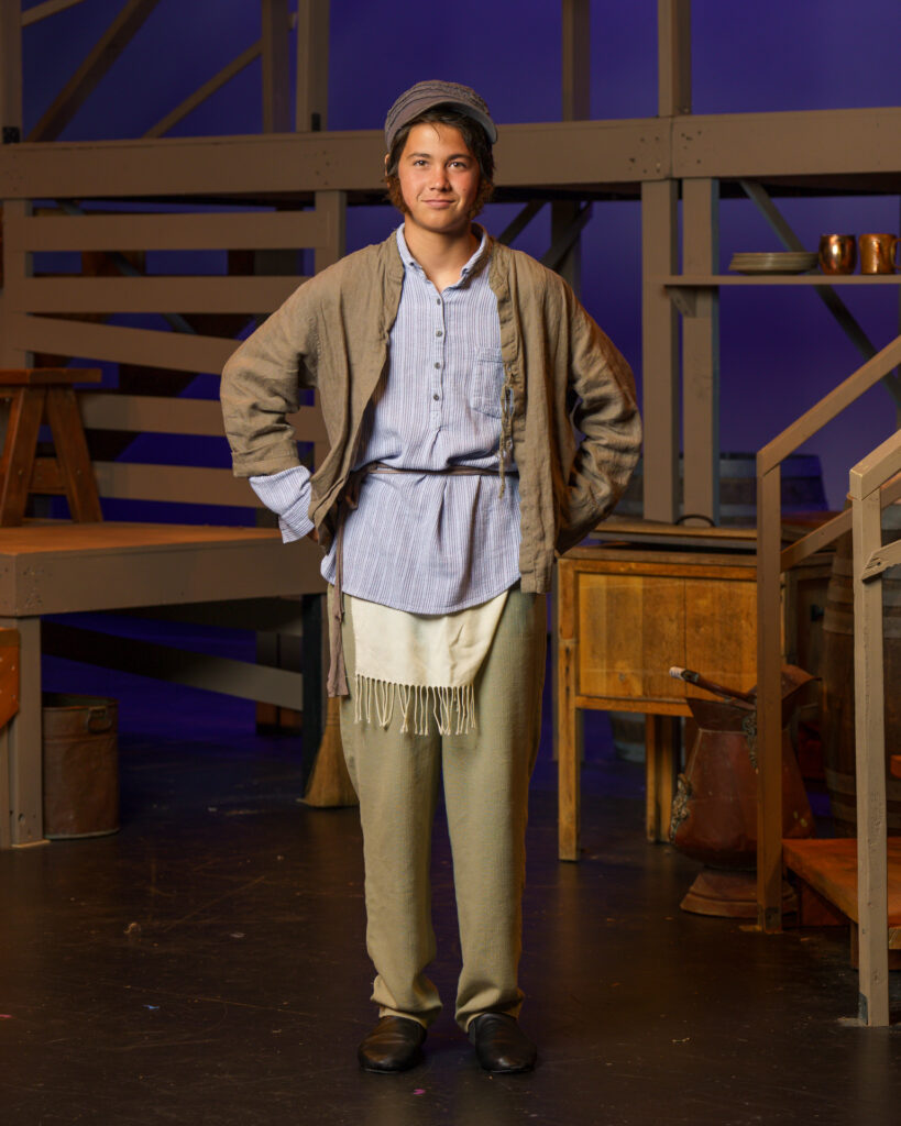Actor in period costume on stage