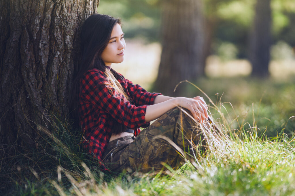 Lifestyle portrait of singer-songwriter Evelyn Ko in a relaxed, natural light setting by Art of Portraits photographer.